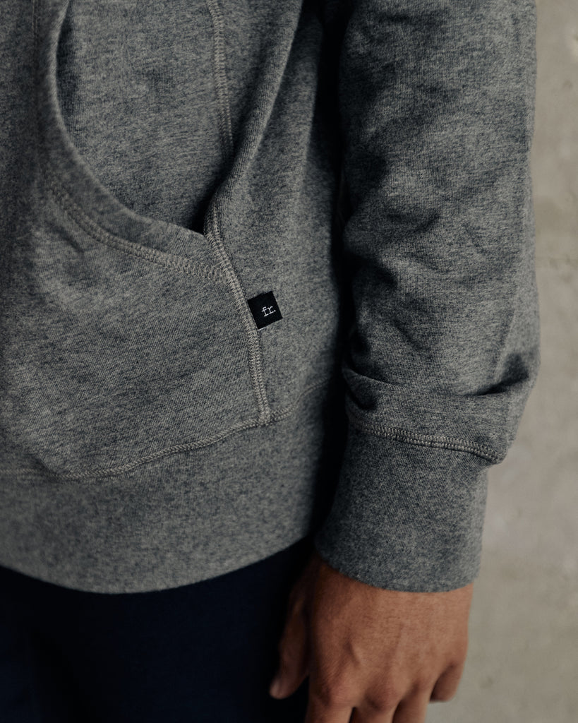 Front pocket, rib cuff and waistband detail on the Foreign Rider Co Performance Hooded Pullover