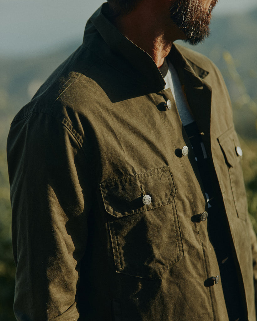 Chest Detail of a man wearing the Foreign Rider Co Waxed Canvas Utility Jacket