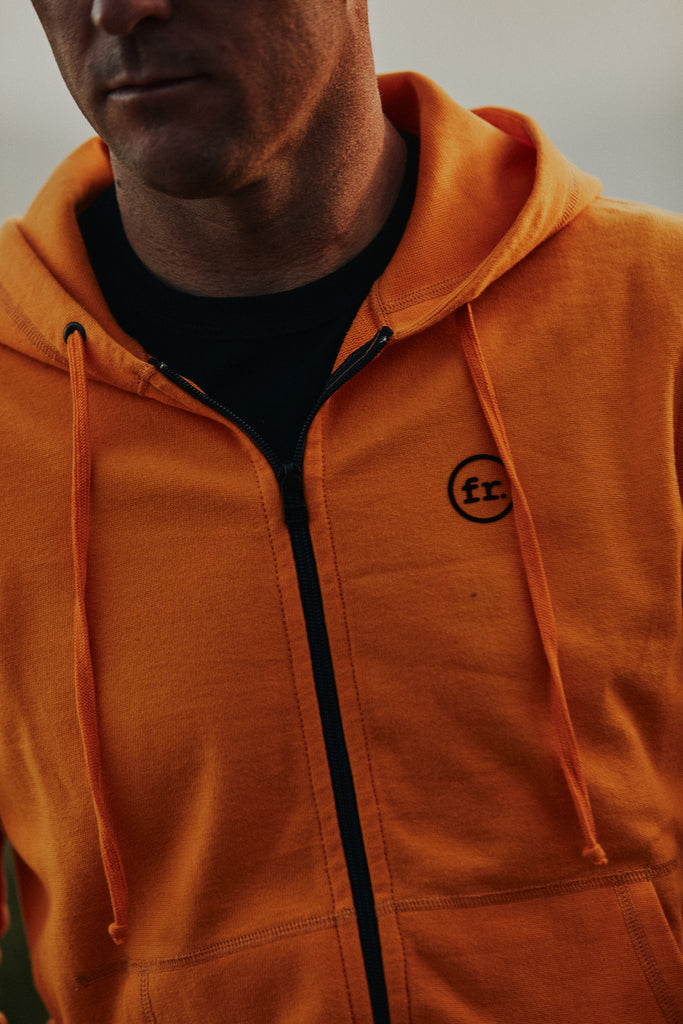 Close up chest detail of the ykk zipper and FR. embroidered logo on the Foreign Rider Full Zip Hooded Vintage Sweatshirt