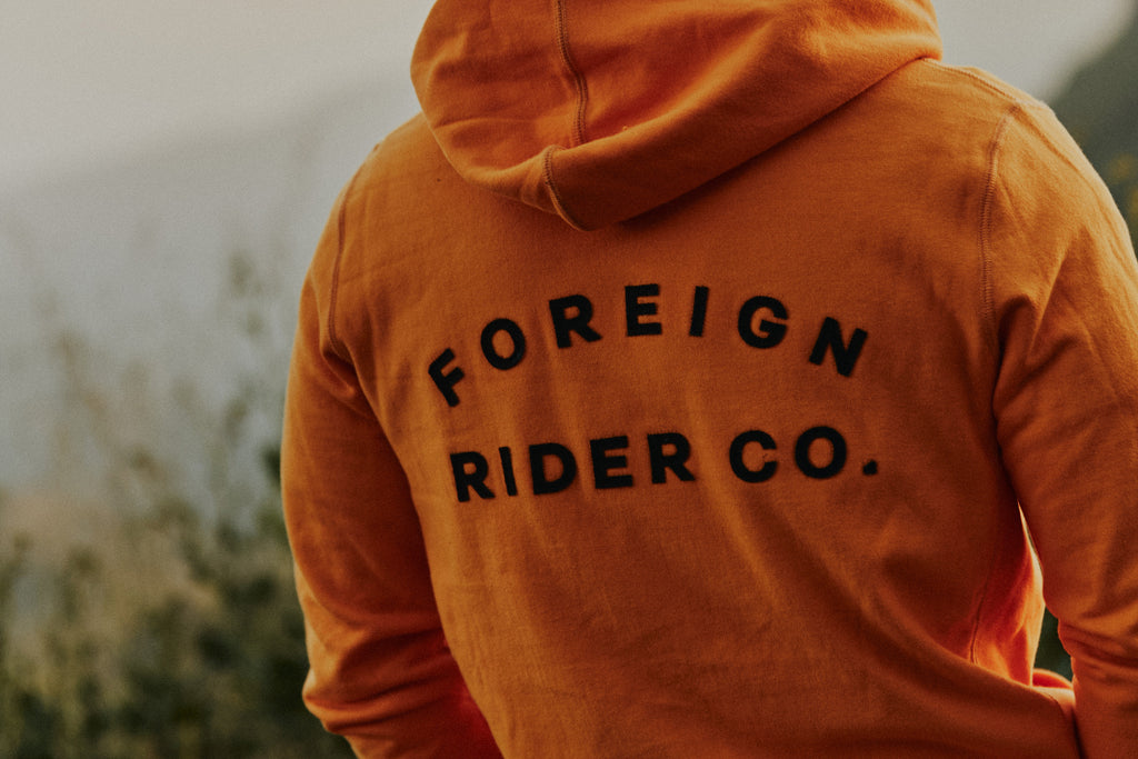 Back shot of the Foreign Rider Co. logo on the Foreign Rider Full Zip Hooded Vintage Sweatshirt