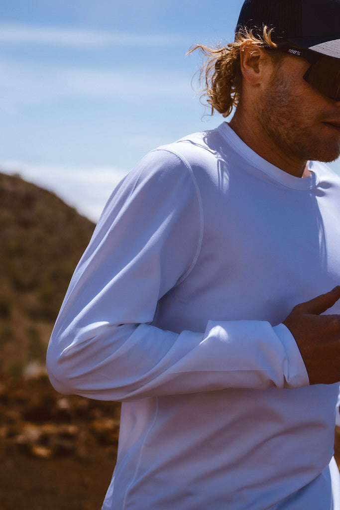 Shoulder & chest detail of the Foreign Rider Performance Long-Sleeve T-Shirt worn by a running Eric Lagerstrom