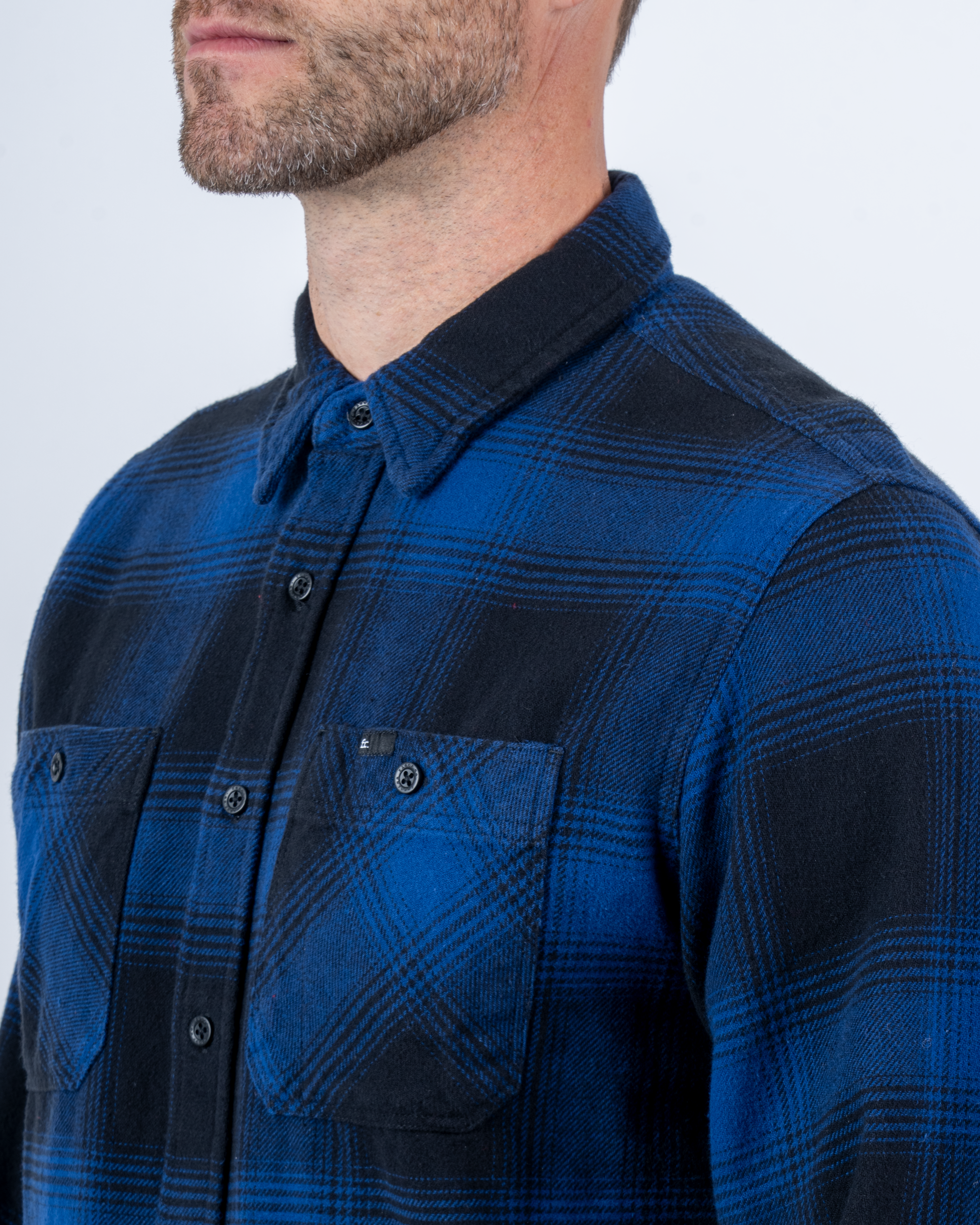 Foreign Rider Co Organic Cotton Blue Flannel Plaid Long Sleeve Button Up Shirt Chest Button Pocket and Shoulder Detail