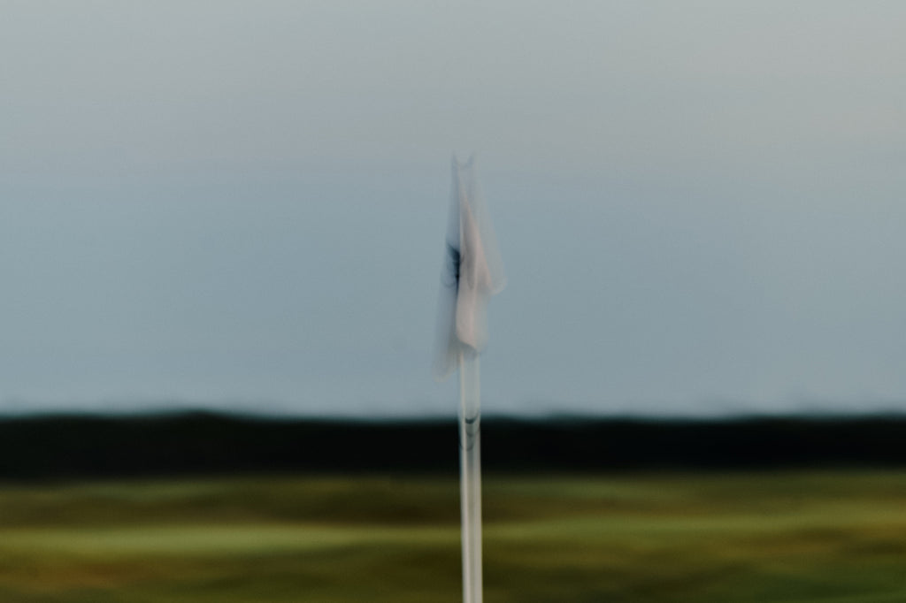 Abstract blurry image of a golf flag at the Grove XXIII Golf Club