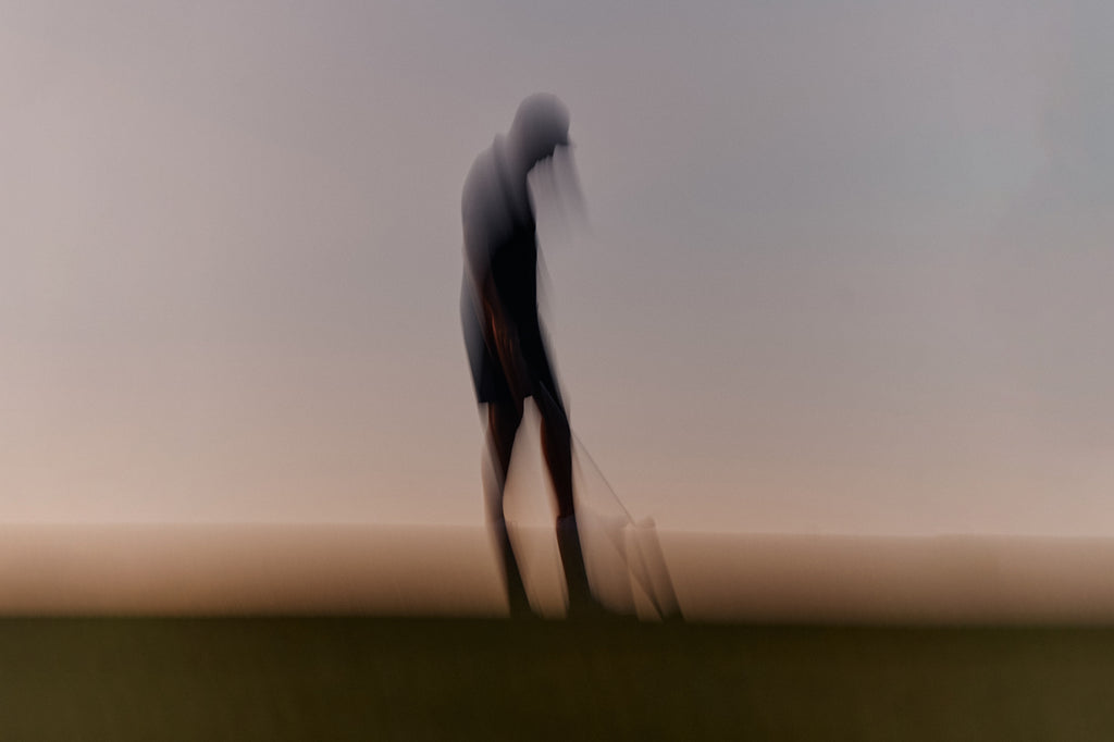 Abstract blurry image of golfer on the horizon at the Grove XXIII Golf Club