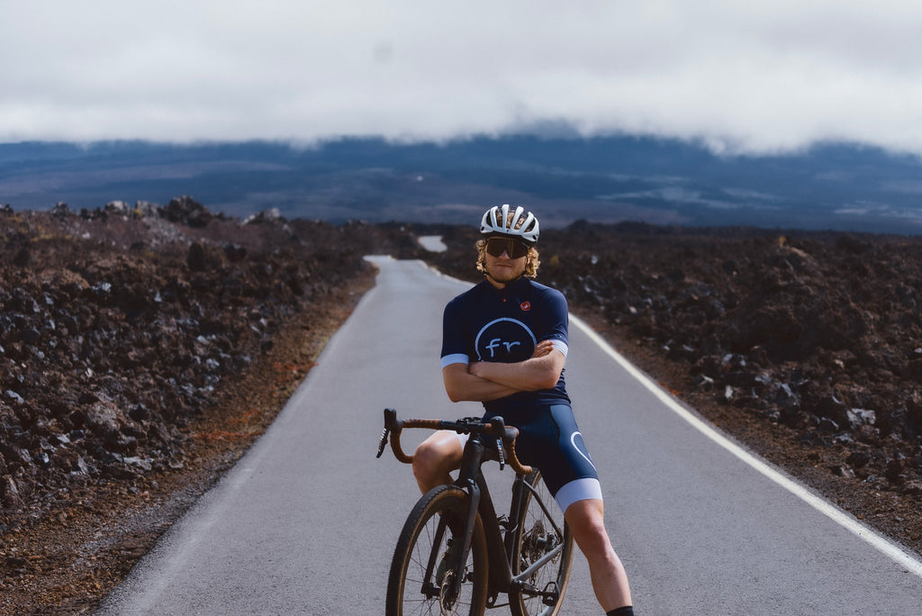 Eric Lagerstrom sitting on bike in the middle of a long Kona road