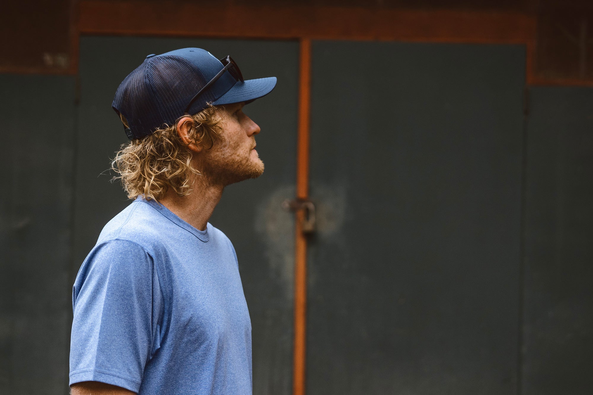 Eric Lagerstrom from the side chest up wearing the Foreign Rider Performance Short Sleeve T-Shirt