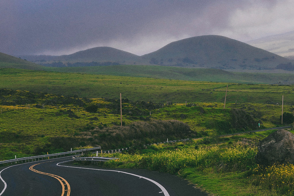 Hawaii Island landscape shot of green rolling mountains and hills and winding roads