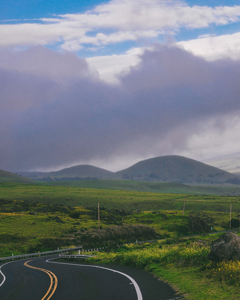 Hawaii Island landscape shot of green rolling mountains and hills and winding roads